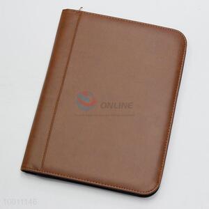 Brown calculator organizer  <em>notebook</em> with zip